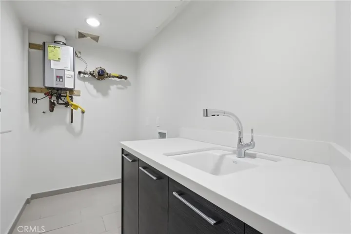 Second level laundry room with tankless waterheater