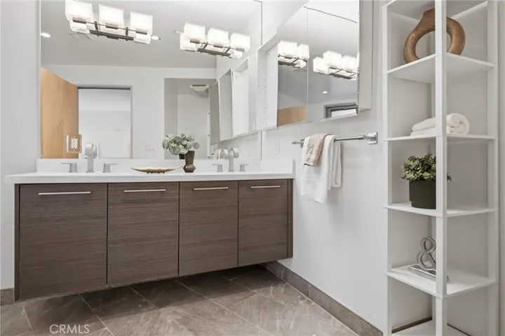 Primary ensuite bathroom with dual vanities