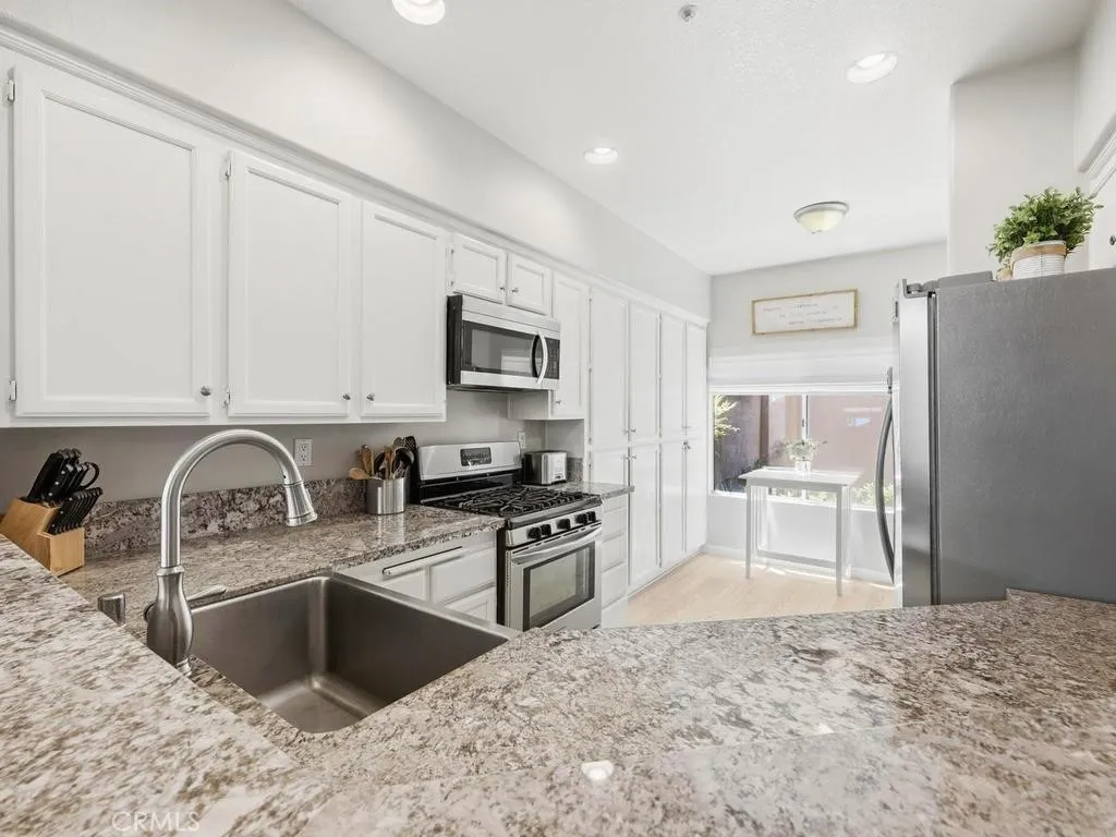 The kitchen has plenty of storage and counter space.