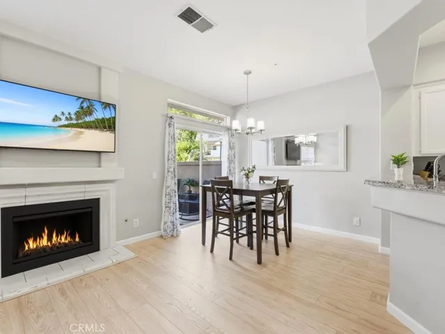 Open dining room with sliding door to patio and easy access to kitchen