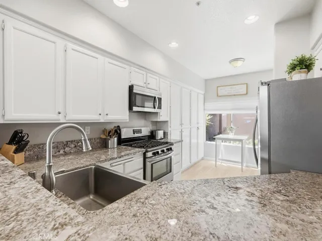The kitchen has plenty of storage and counter space.