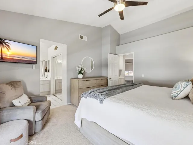 Primary suite with walk-in closet and bathroom