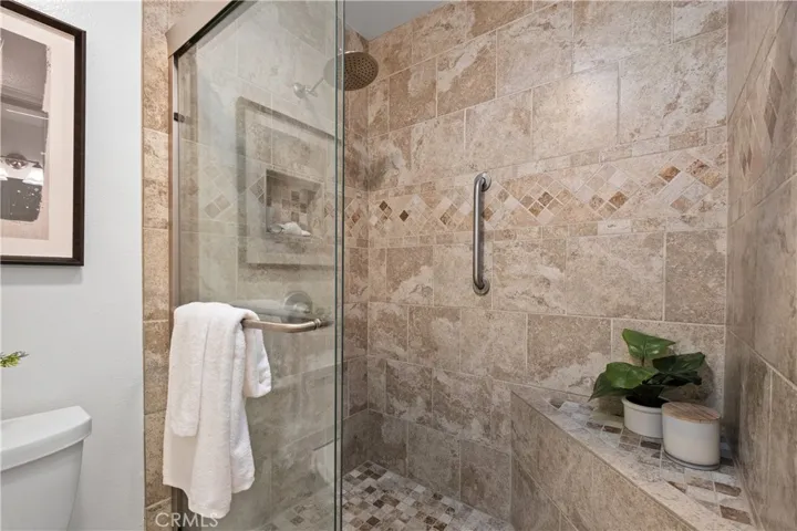 Primary shower with travertine
