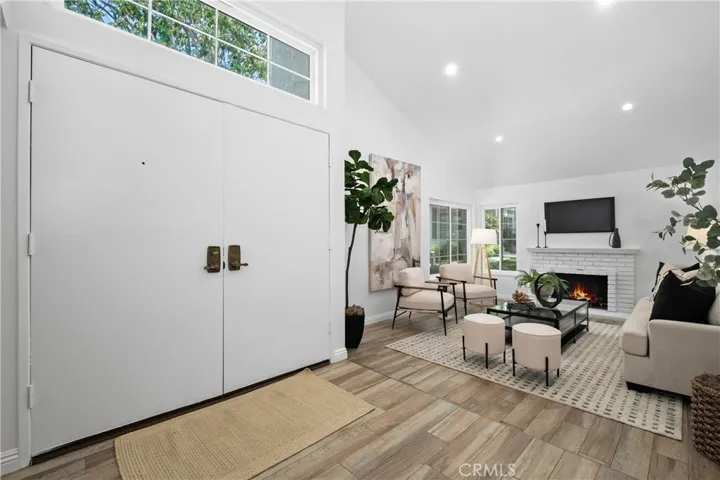 Elegant wood-style tile flooring carried throughout