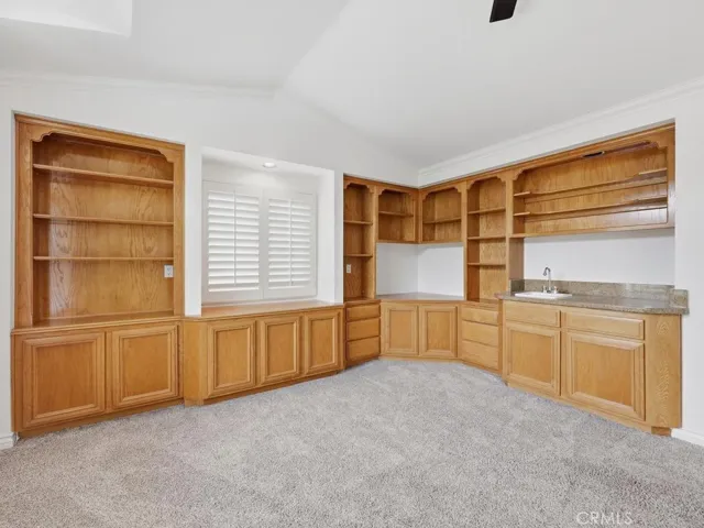 Bonus room has built in shelving and wet bar
