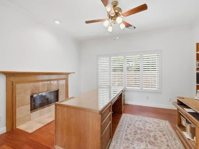 Downstairs bedroom/office with double sided fireplace