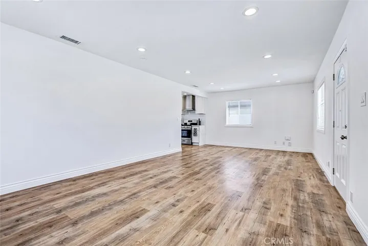 Spacious living room is open to the newly renovated kitchen.