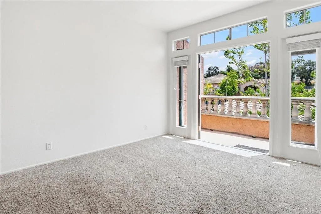 Primary bedroom w/ french doors to deck