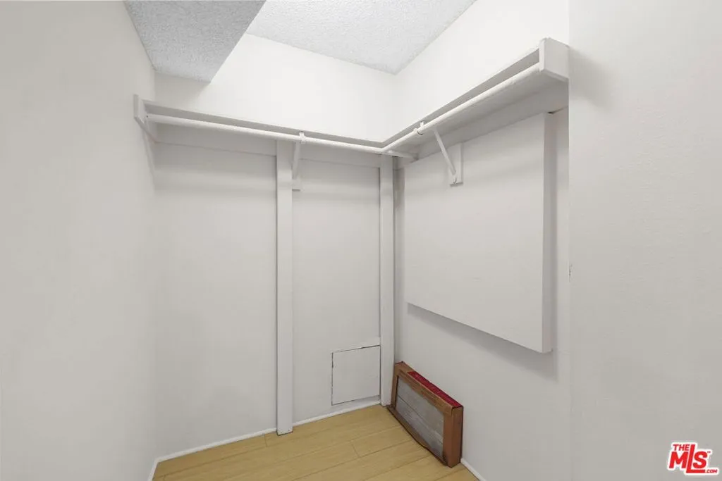 Hallway closet has plenty of s