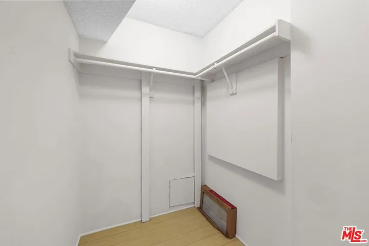 Hallway closet has plenty of s