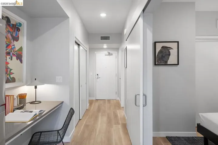 Integrated desk area with recessed lighting and under-cabinet illumination