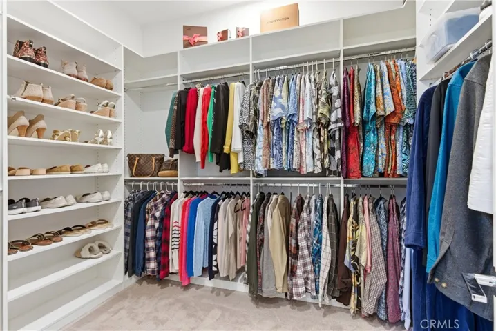 Spacious walk-in closet with custom organization