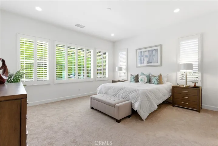 The spacious primary suite includes ensuite bathroom, walk-in closet and large linen closet.