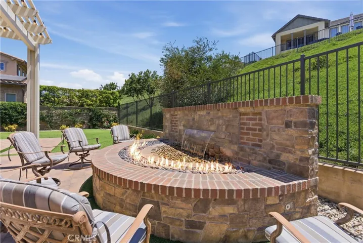 The water feature is surrounded by a ring of fire...perfect for ambiance and warmth so you can spend time in your backyard anytime of year