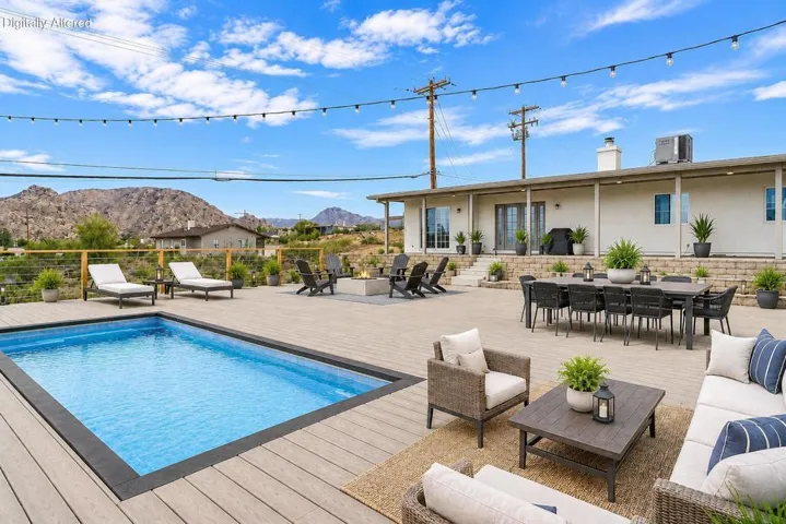 Back patio by pool- daytime- staged