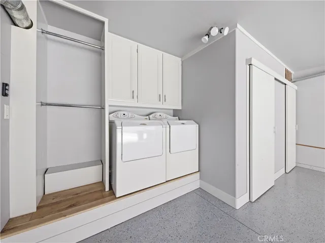 Custom garage laundry area and storage.