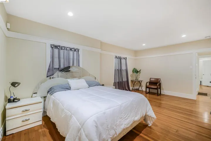 Bedroom featuring hardwood / wood-style flooring and recessed lighting