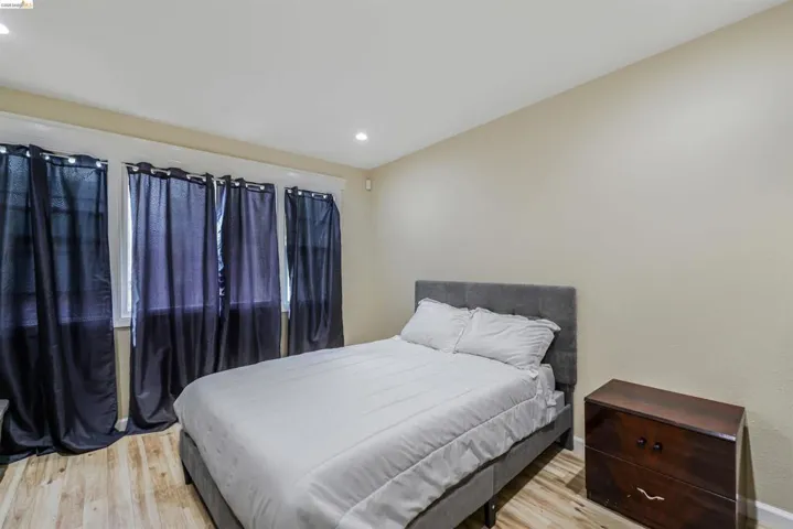 Bedroom featuring recessed lighting and light wood-type flooring