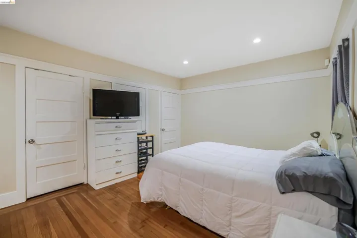 Bedroom featuring wood-type flooring and recessed lighting