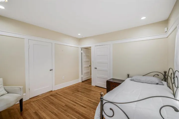 Bedroom featuring recessed lighting and wood finished floors