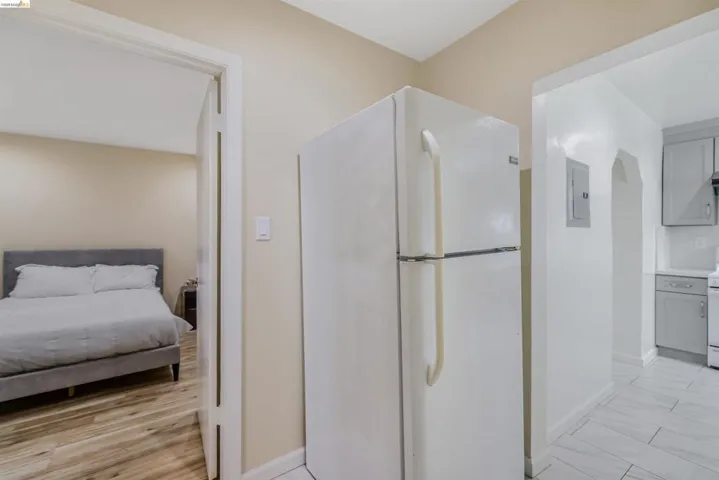Bathroom featuring vanity, electric panel, and light wood-style floors