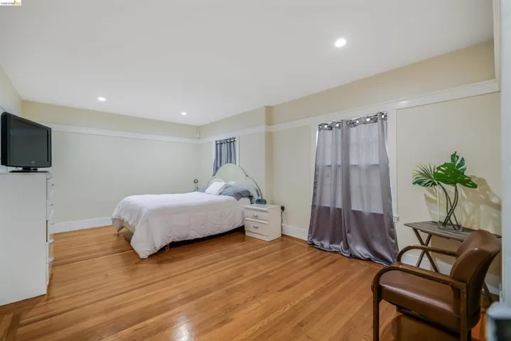 Bedroom featuring light wood-style flooring and recessed lighting