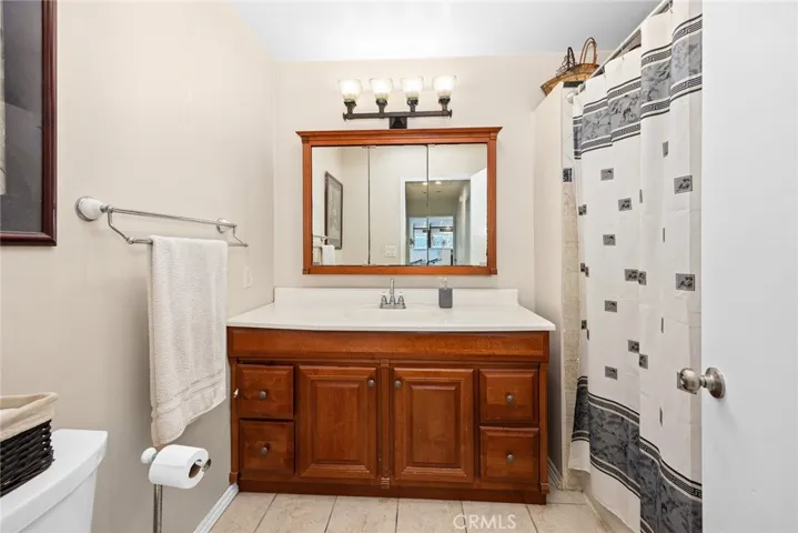 full hall bath has tiled shower and tub