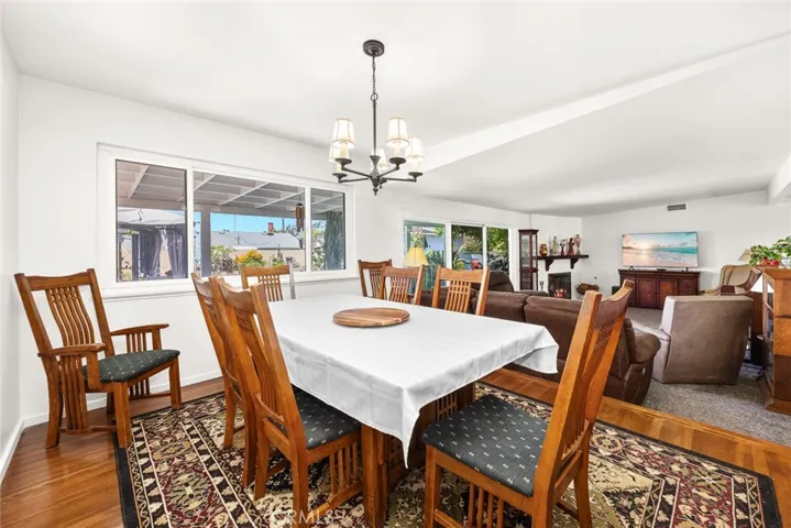 large formal dining room with oak flooring