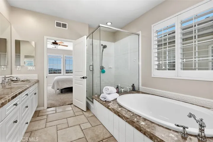 Master Bathroom with soaking tub. Marble tops.