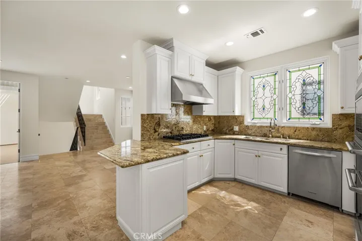Kitchen filled with natural light and ocean breezes.