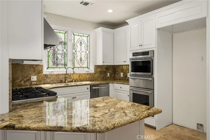 Kitchen filled with natural light and ocean breezes.