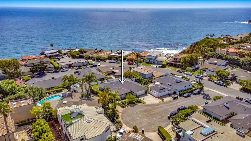 Aerial view of home and Ocean in the back drop.
