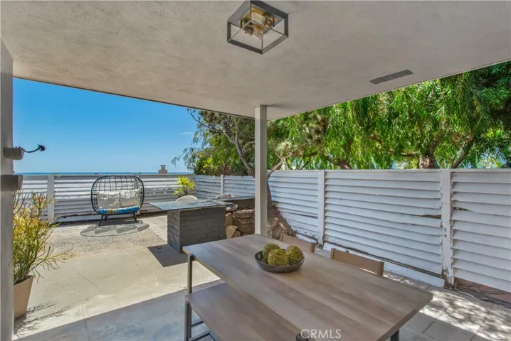 Back yard covered patio towards ocean view.
