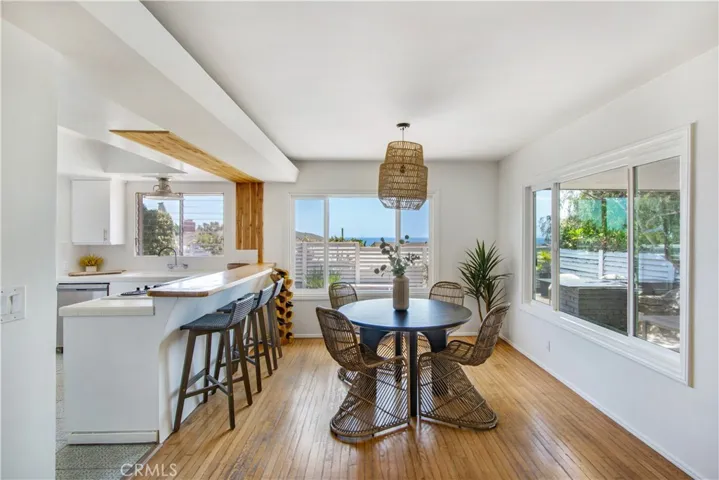 Kitchen including breakfast bar and dining room area.