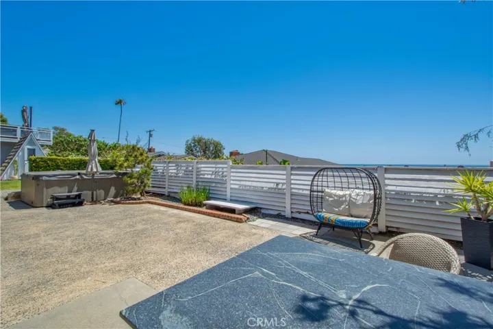 View of back yard towards view of ocean.