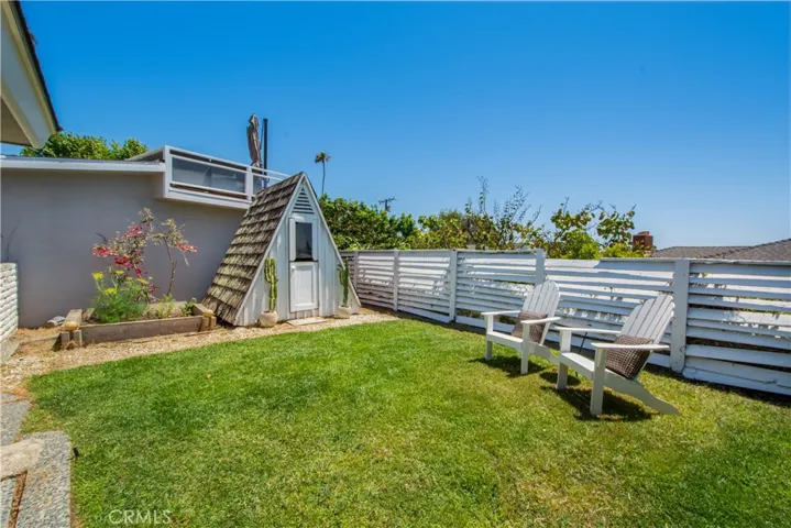 Back yard view of cottage.