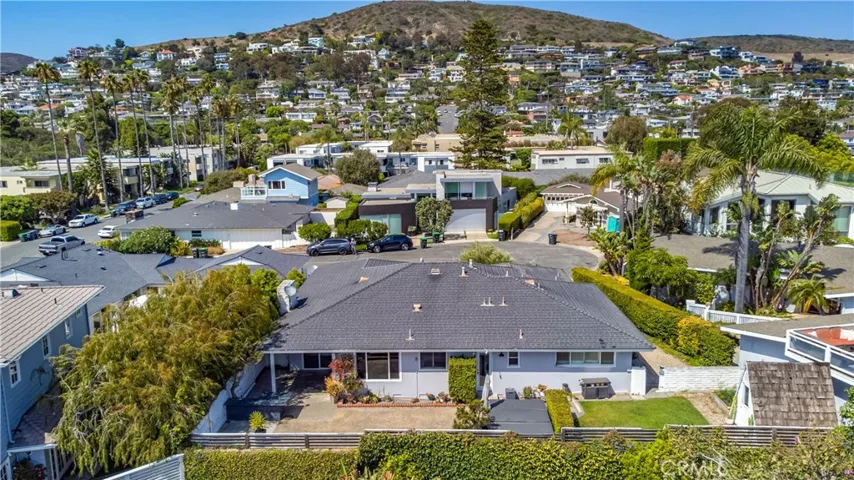 Aerial view of rear of home and back yard.