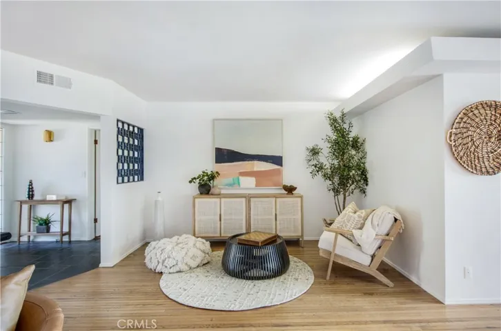 View from living room towards main entry and sitting area.