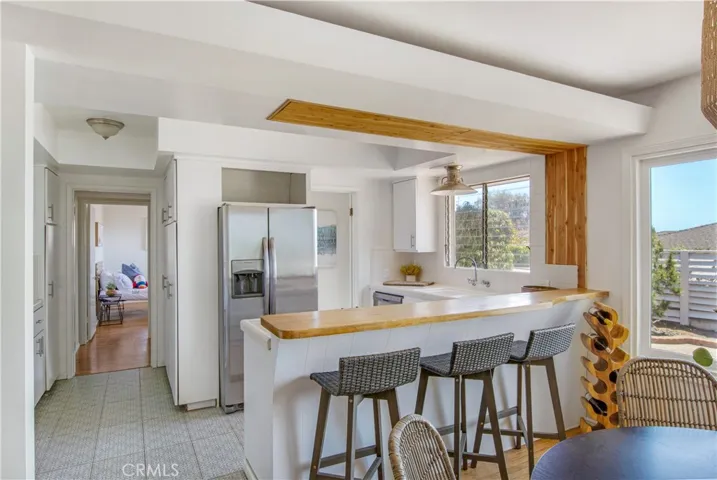 View into kitchen and in the backdrop 3rd bedroom.