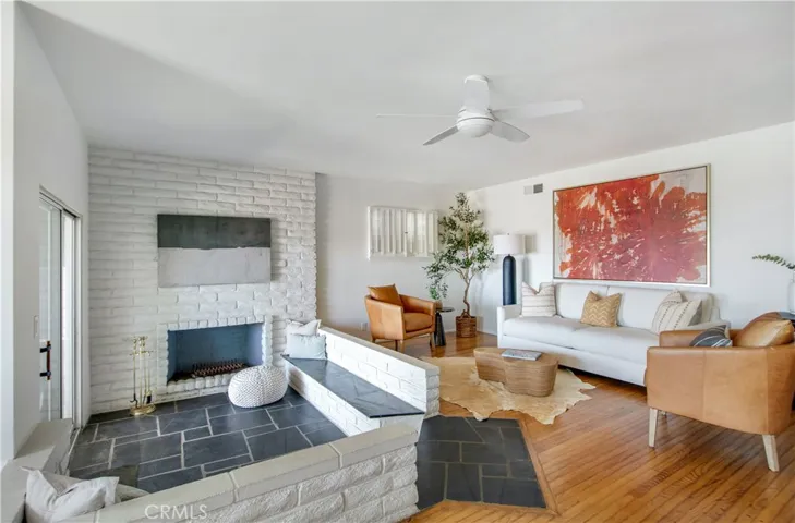View of living room and fireplace sitting area.