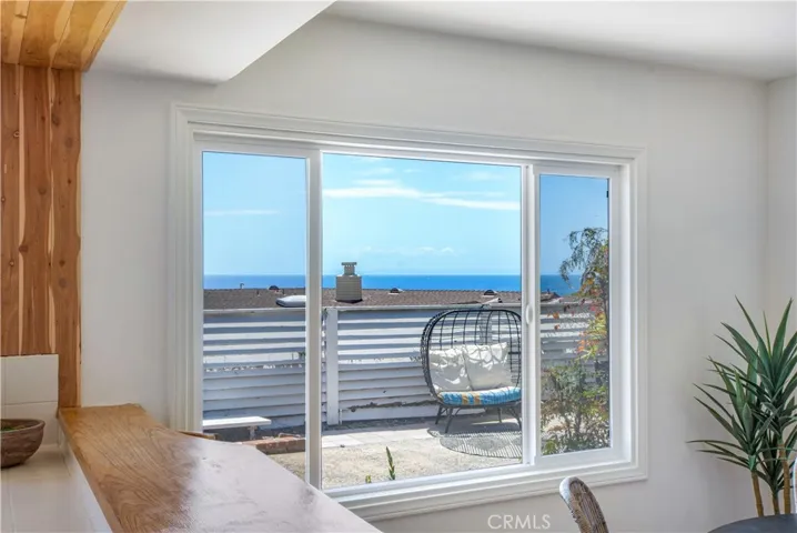 View from kitchen to back yard and ocean view!