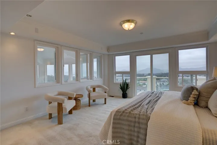 primary bedroom with private deck and ocean views