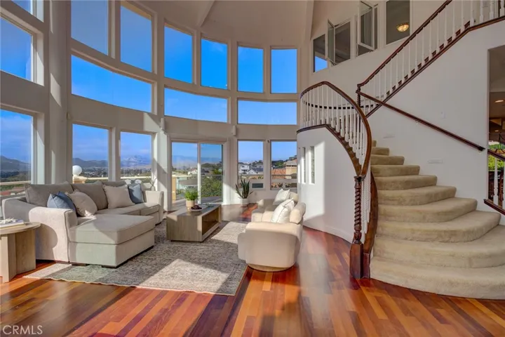 stairs to upper level with views