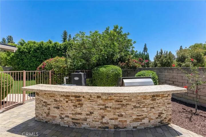 Outdoor Kitchen With Room For Plenty Of Seating