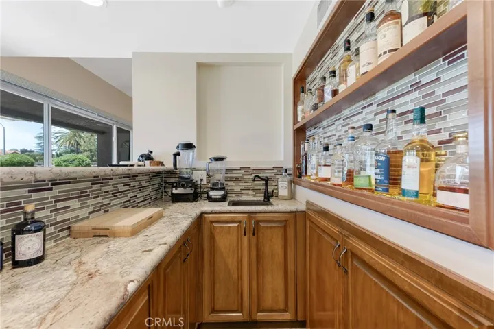 Wet Bar With Plenty Of Cabinet and Counter Space