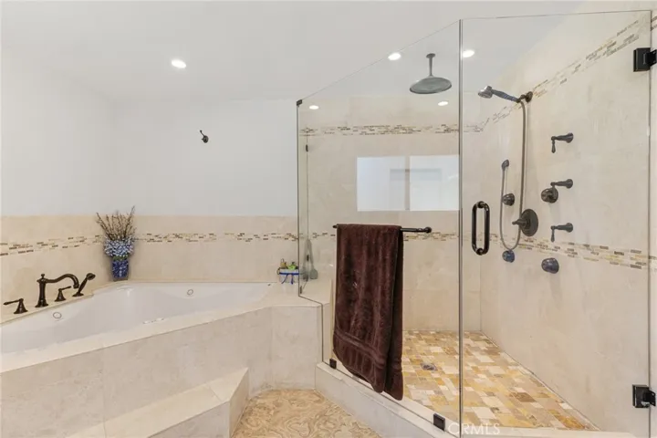 Primary En Suite - Jetted 2 Person Tub, Large Shower With Standard Shower Head, Rain Shower Head, And Multiple Body Sprays