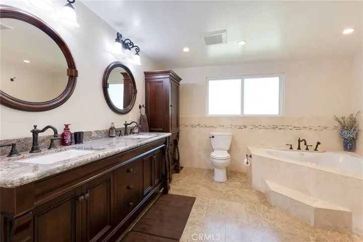 Primary En Suite Bathroom - Granite Topped Dual Sink Vanity