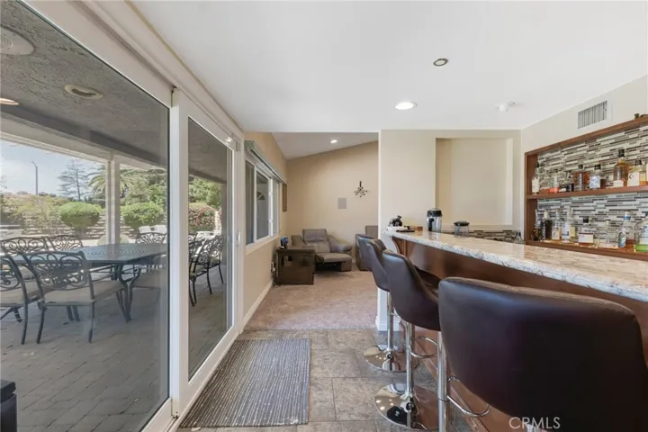 Wet Bar Pass Through From Family Room To Living Room & Slider To Back Patio
