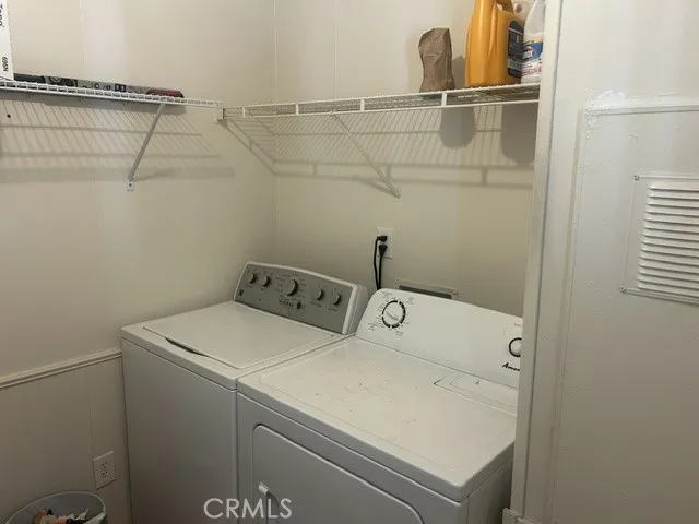 Laundry room located to the right of back door off the kitchen