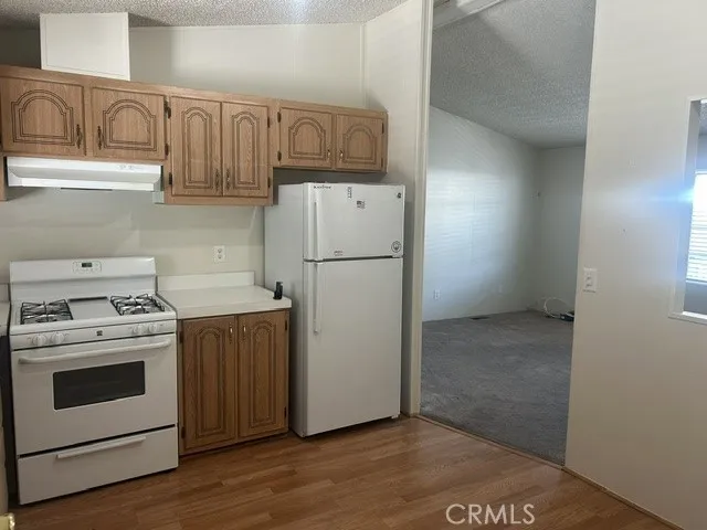 Kitchen angle looking from laundry room in to family room